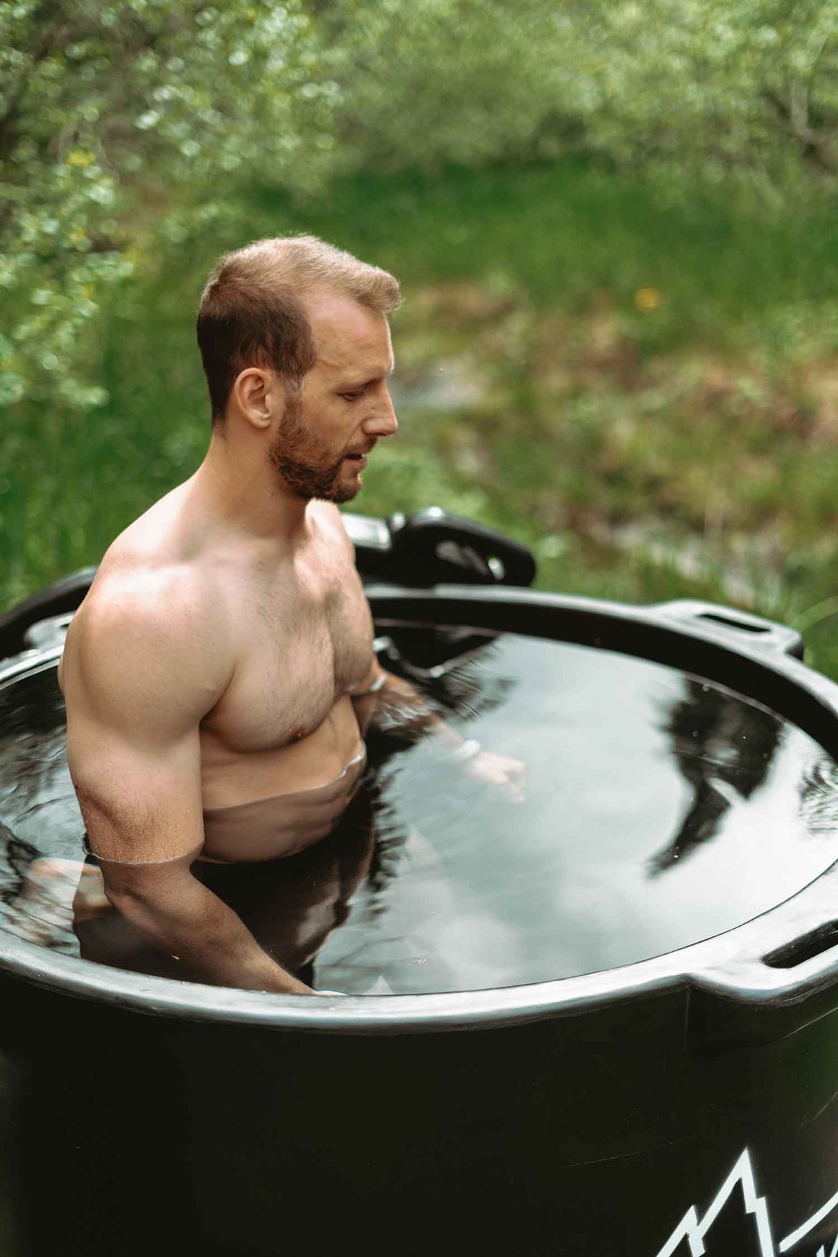 A model takes an ice bath in the HD Pro cold plunge