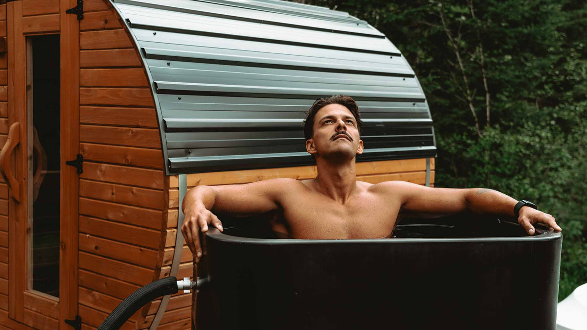 A man cold plunging in his HD Ultimate outdoors